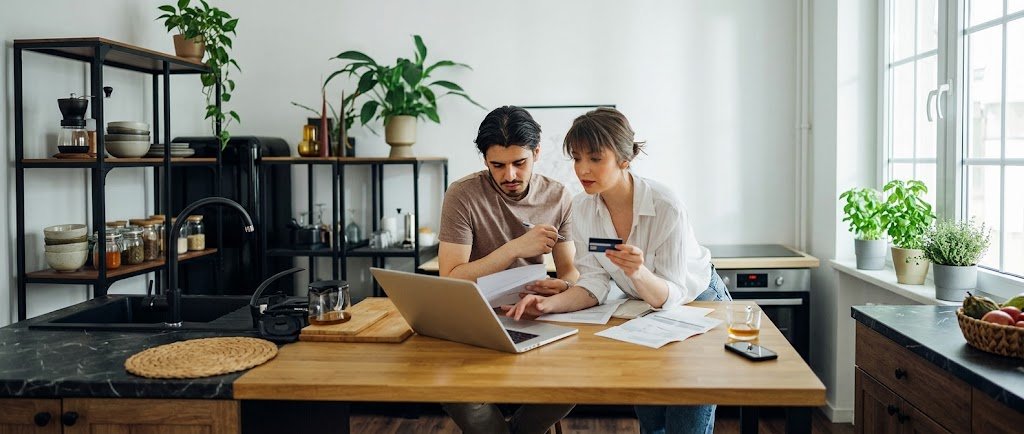 Two people comparing being an authorized user vs joint account holder on a credit card