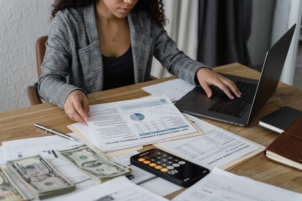 Comparing debt settlement vs debt consolidation options while reviewing bills