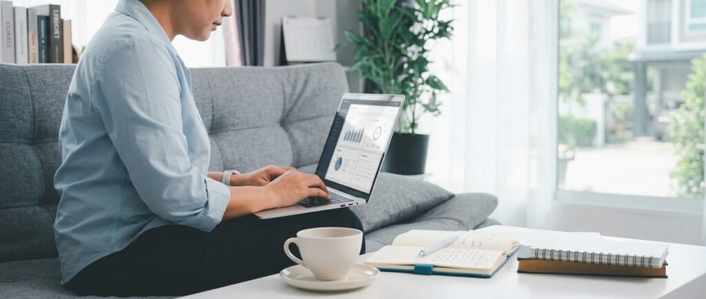 Remote worker on a laptop at a home desk, exploring high paying remote jobs