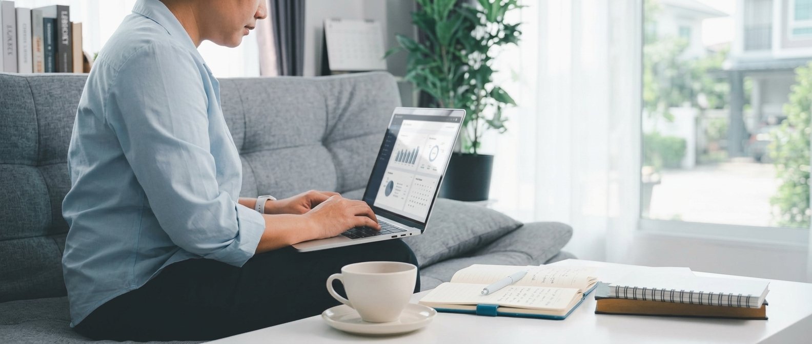 Remote worker on a laptop at a home desk, exploring high paying remote jobs