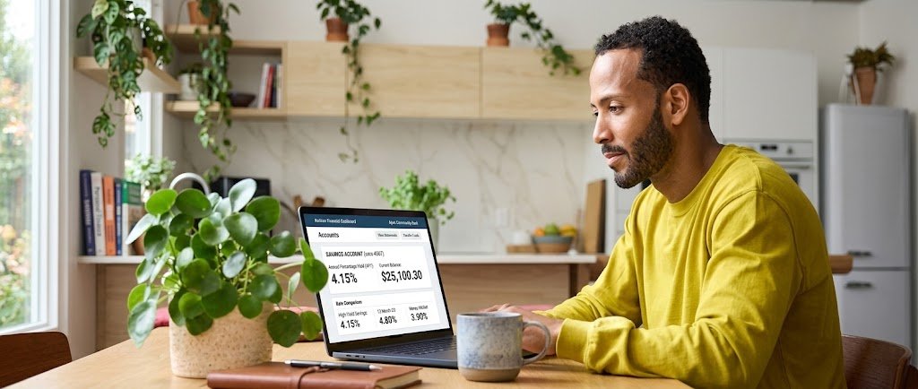 Person reviewing high-yield savings account APY rates on a laptop
