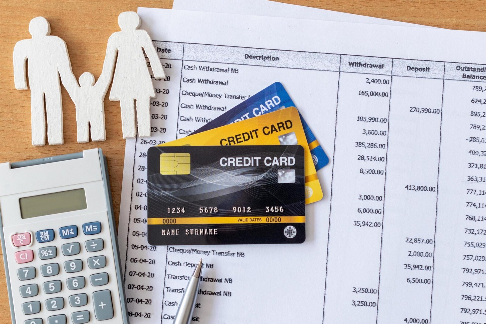 hm Person reviewing a credit card statement and using a calculator to plan a debt payoff timeline