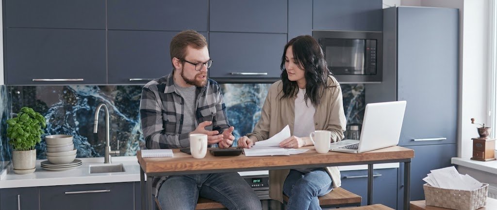 Person reviewing a call log and bills to document loan recovery agent harassment