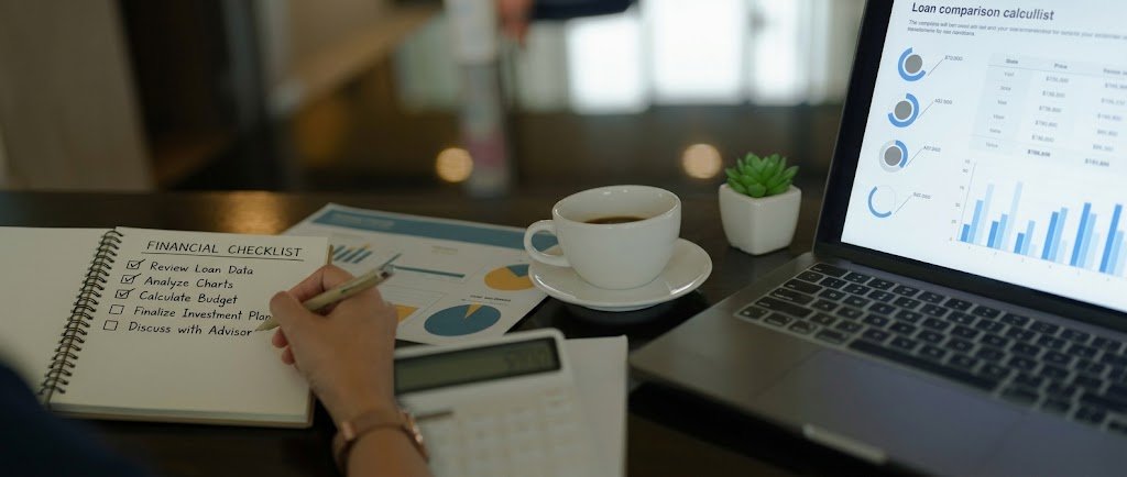 Financial checklist for your 30s written in a notebook beside a laptop and coffee cup
