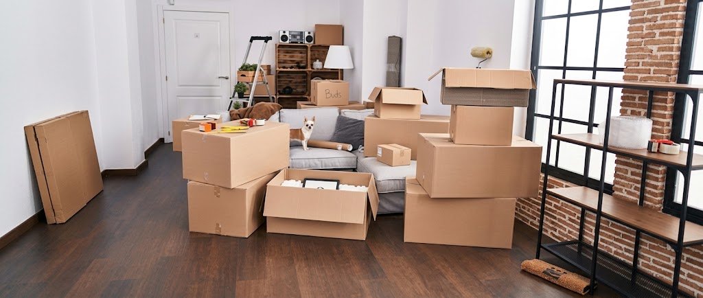 Stacked moving boxes in a new apartment, illustrating the costs that lead people to consider moving loans