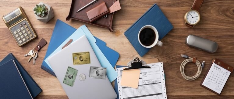 Card stacking strategy shown with multiple credit cards laid out beside a notebook for planning rewards by category