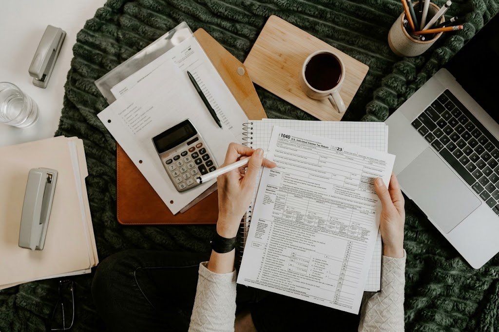 Borrower reviewing a loan sanction letter and highlighting key terms at a desk