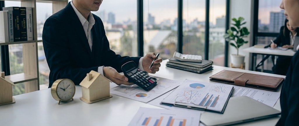 Bank statement and calculator on a desk used to compare overdraft vs personal loan costs